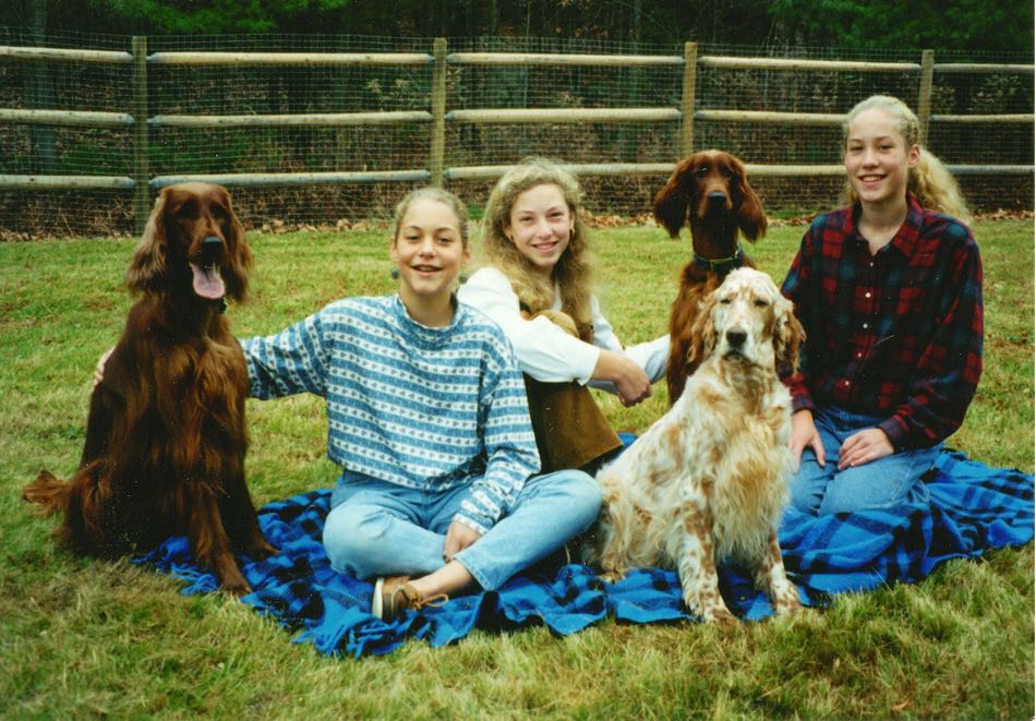 Our three daughters with our Irish Setters, Breezy and DD and our English Setter Beatrice (also my first therapy dog)