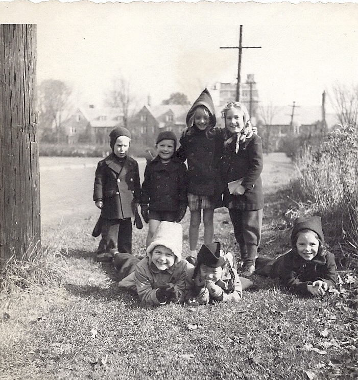 With missionary kids (center, hooded coat)